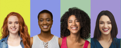 Diverse line of women smiling