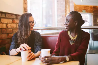 Two young women coffee